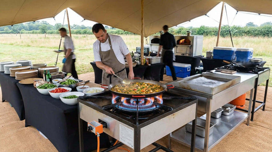 Level Up Your Catering Game: Menu Ideas for Your Propane Burner - chef cooking paella on propane burner at outdoor catering tent