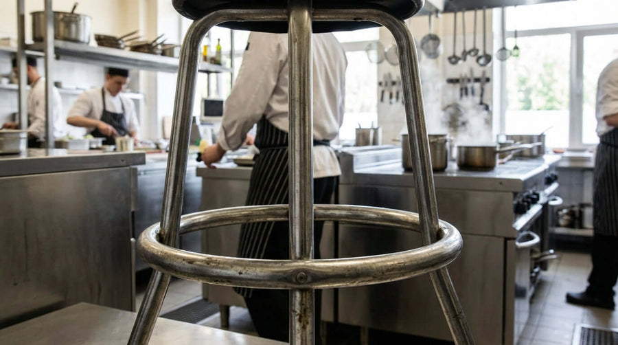 Why Investing in Heavy-Duty Footrest Rings Saves You Money in the Long Run - heavy-duty metal footrest ring on kitchen stool in busy restaurant