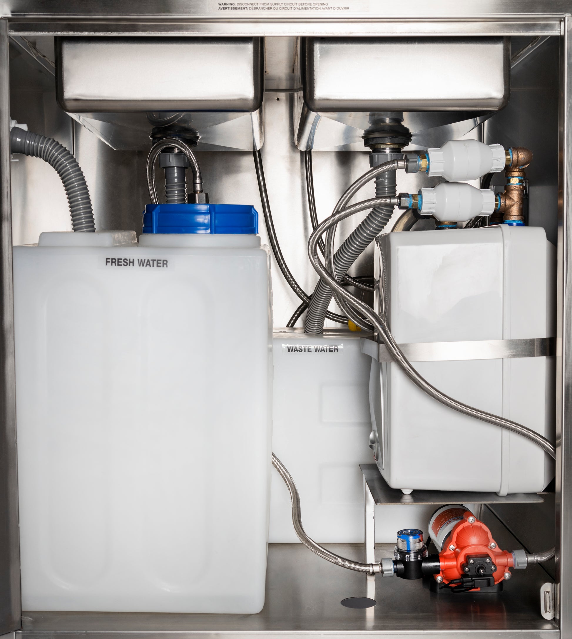 Interior View Of Ancaster AFE-SB101 Portable Sink Unit With Hot Water Featuring Fresh Water Tank And Plumbing Components