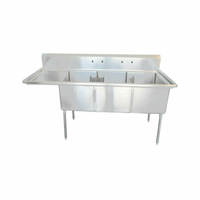 Three Compartment Prep Sink With Drainboard Featuring Stainless Steel Construction And Three Compartments For Food Preparation.