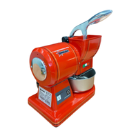 Étiquette alternative : Râpe à fromage électrique rétro Trento 48109 66 lb. Râpe électrique à fromage rouge d’une capacité avec trémie et bol