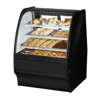 Curved Glass Bakery Display Case Featuring Assorted Baked Goods On Shelves In A Black Finish