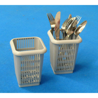 Small Dishwasher Cutlery Basket With Forks And Spoons Organized In Two Compartment Baskets On Blue Background