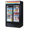 Two Door Glass Merchandiser Refrigerator Displaying Beverages And Packaged Food Items In A Retail Setting