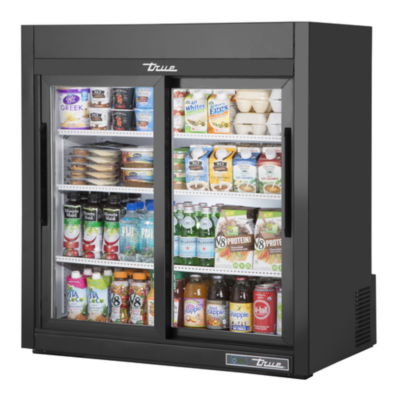 True Manufacturing 36" Wide Countertop Glass Door Refrigerator Merchandiser Filled With Cold Beverages And Packaged Foods