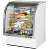 Alt Tag: True TCGG-36-HC-LD 36-Inch Curved Glass Refrigerated Deli Case with curved glass display of salads, drinks, and packaged foods