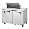 True TSSU-48-08-HC 48-Inch Solid Door Sandwich Salad Prep Table Featuring Fresh Ingredients In Pan